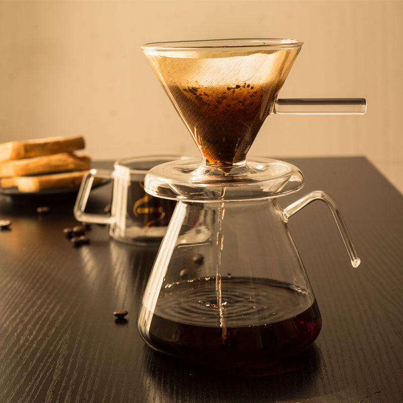 Barista-level control with our Pour Over Coffee Maker Set. Dual-layer filter for slow drips, rich flavor notes. Heat-resistant glass carafe for stove & microwave, zero odors. Easy to clean with wide opening and detachable dripper base. Elegant, space-saving base for a mess-free experience. Brew perfection, anytime, anywhere.